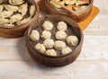 Handmade steamed dumplings and fried dumpling or momo served in wooden dish isolated on table top view Japanese food Royalty Free Stock Photo