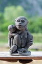 A handmade stone doll of mother and child monkey