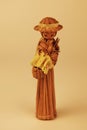 Handmade straw figure of a lovely woman wearing a hat