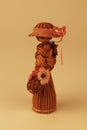 Handmade straw figure of a lovely woman wearing a hat