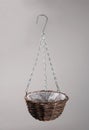 Handmade strawbasket hanging flowerpot with chain Royalty Free Stock Photo