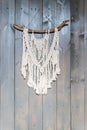 Handmade stylish cotton macrame decoration. Copy space.boho home interior decor,macrame wall hanging decoration, cozy