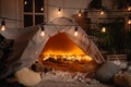 Handmade tent with blankets, pillows, toys and lights