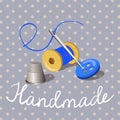 Handmade. thread with a needle, thimble, on a vintage background