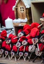 Handmade tio de nadal, a typical christmas character of catalonia, spain, on sale in a christmas market