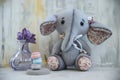 Handmade toy gray elephant with purple flower Royalty Free Stock Photo