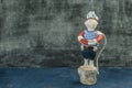 Handmade toy sailor boy figure in vest lifebuoy Royalty Free Stock Photo