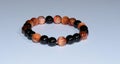 Handmade unique bracelet from tiger eye and onix mineral beads Royalty Free Stock Photo