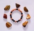 Handmade unique bracelet from tiger eye and onix mineral beads Royalty Free Stock Photo