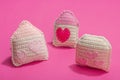 Handmade Valentines Day concept. Creative house figurines, traditional hearts, spring crocheting