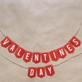 Handmade Valentines Day red paper banner lettering message. Nice Holiay postcard, greeting card template. Empty space (copyspace)