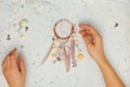 Handmade vintage dream catcher with woman hands