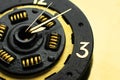 Handmade watches on a gold background. A clock from a car clutch disc. Black watch with gold elements. Trending color Royalty Free Stock Photo