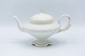 Handmade white ceramic teapot with gold painted details