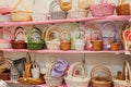 Handmade wicker colorful baskets of different sizes on the shelf of the market. Handmade crafts. Reusable packaging. No plastic Royalty Free Stock Photo