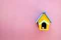 Handmade wood home on pink wall Royalty Free Stock Photo
