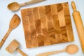 Handmade wooden board and kitchen tools on white background: woo Royalty Free Stock Photo