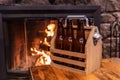 Handmade wooden carrying case for six beer bottles with a metal bottle opener on a side