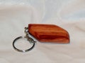 Handmade wooden wooden keychain made of exotic pink tulip tree Royalty Free Stock Photo