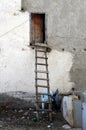 Handmade wooden ladder leaning against wall
