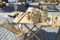 Handmade wooden objects, displayed in a rustic fair for working people