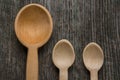 Handmade wooden spoons on a wooden board, kitchen tools Royalty Free Stock Photo