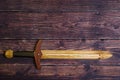 Handmade wooden training toy sword on the table Royalty Free Stock Photo