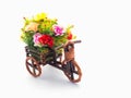 Handmade wooden tricycle toy with flower in the basket isolated Royalty Free Stock Photo