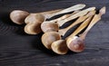 Handmade wooden utensils on the kitchen. Wooden spoons, bowl, dishes and vase Royalty Free Stock Photo