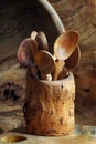 Handmade wooden utensils on the kitchen. Wooden spoons, bowl, dishes and vase Royalty Free Stock Photo