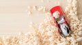 Handmade woodwork: a small red plane on the boards in shavings Royalty Free Stock Photo