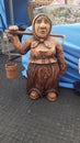 Handmade statuette. Souvenir. Carving. Grandma with buckets