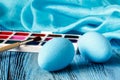 Handmaid blue paint easter egg on table with scarf Royalty Free Stock Photo