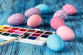 Handmaid blue paint easter egg on table with scarf Royalty Free Stock Photo