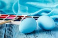 Handmaid blue paint easter egg on table with scarf Royalty Free Stock Photo