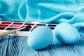 Handmaid blue paint easter egg on table with scarf