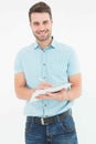 Handome delivery man writing on clipboard Royalty Free Stock Photo