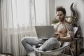 Handosme Man Working at Home with Computer