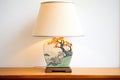 handpainted bedside lamp depicting landscape, on wooden tray