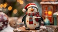 A handpainted ceramic ornament in the shape of a winter penguin wearing a cozy scarf and holding a small present. Royalty Free Stock Photo