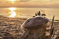 Handpan with sea and beach at sunset. Hang is a musical instrument for meditation.