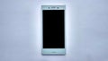 Handphone black screen in white background minimalist and elegant . Royalty Free Stock Photo