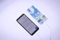 Handphone charging with indonesian money