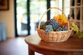 handpicked grapes in a wicker basket near a tasting table