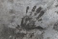 Handprint on cement. Memorable handprint of a hand in an old concrete wall. Copy space for text