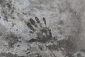 Handprint on cement. Memorable handprint of a hand in an old concrete wall. Copy space for text