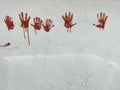 bloody red hands print on white wall Royalty Free Stock Photo