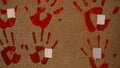 handprints of red, bloody color, on a cork board Royalty Free Stock Photo