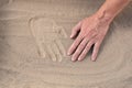 Handprints in sand, top view Royalty Free Stock Photo