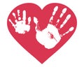 Handprints of son and father in heart shape. Relationship between child and father, love. Imprint of baby palm hand and man palm. Royalty Free Stock Photo